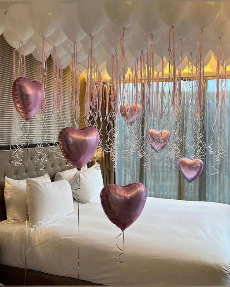 White Balloons With Pink Strings Room Setup
